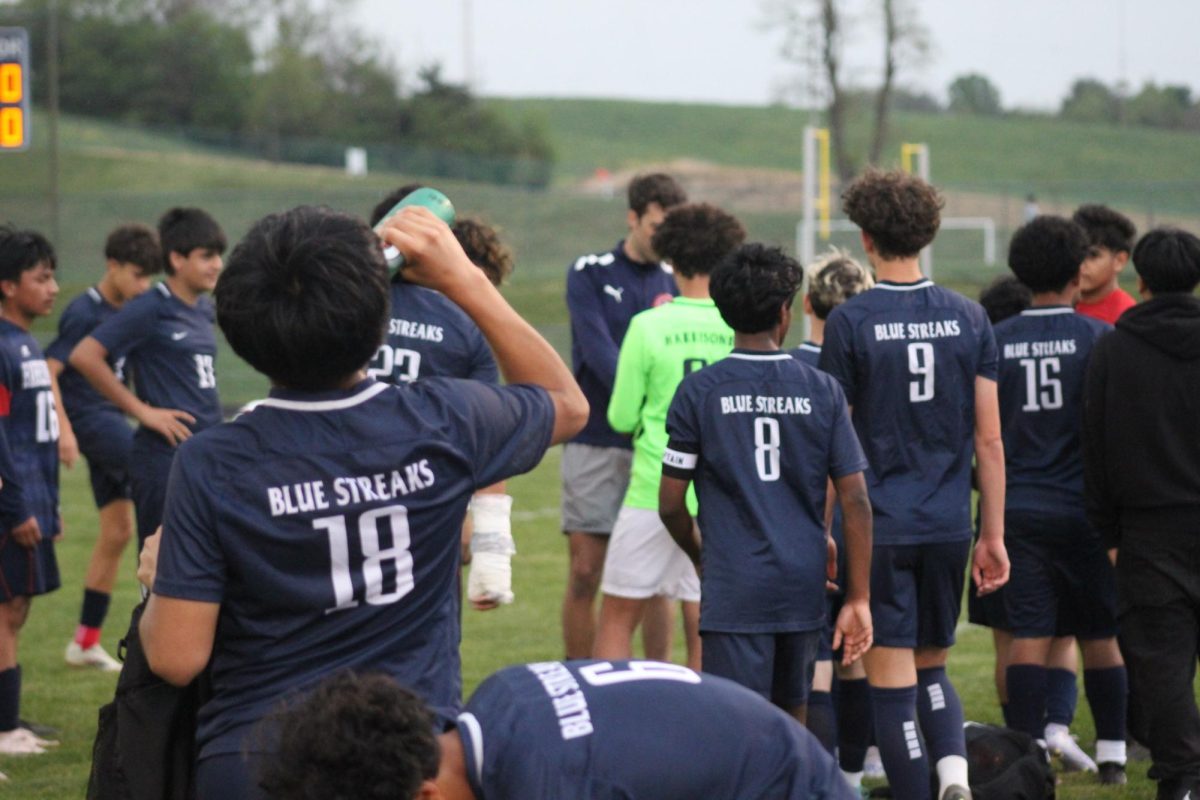 JV boys soccer team prepare to pack their stuff to leave.