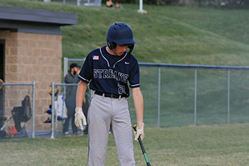 Freshman Abram Wenger is focused, calm, and ready to crush the next pitch.