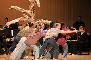 Fine art students express themselves as they dance on stage during the roots run deep show.