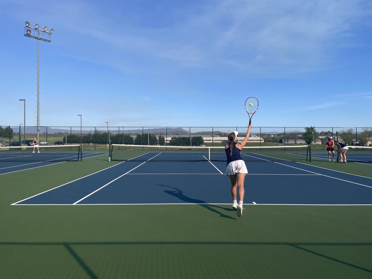 Senior Macy Waid hits the ball back to her opponent. 