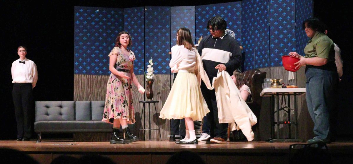 Most of the spring play: The Bloodstained Locks, stand around, chatting.