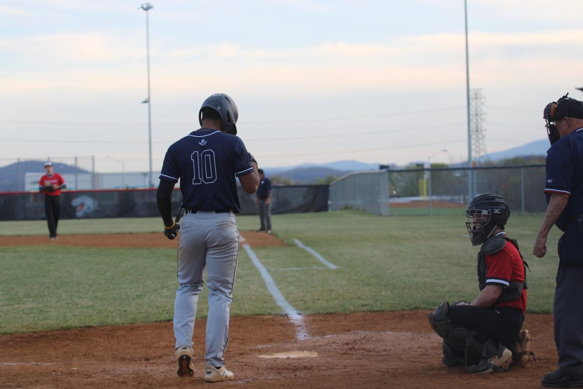 senior Johan feliz waiting for the other team to go on the outfields