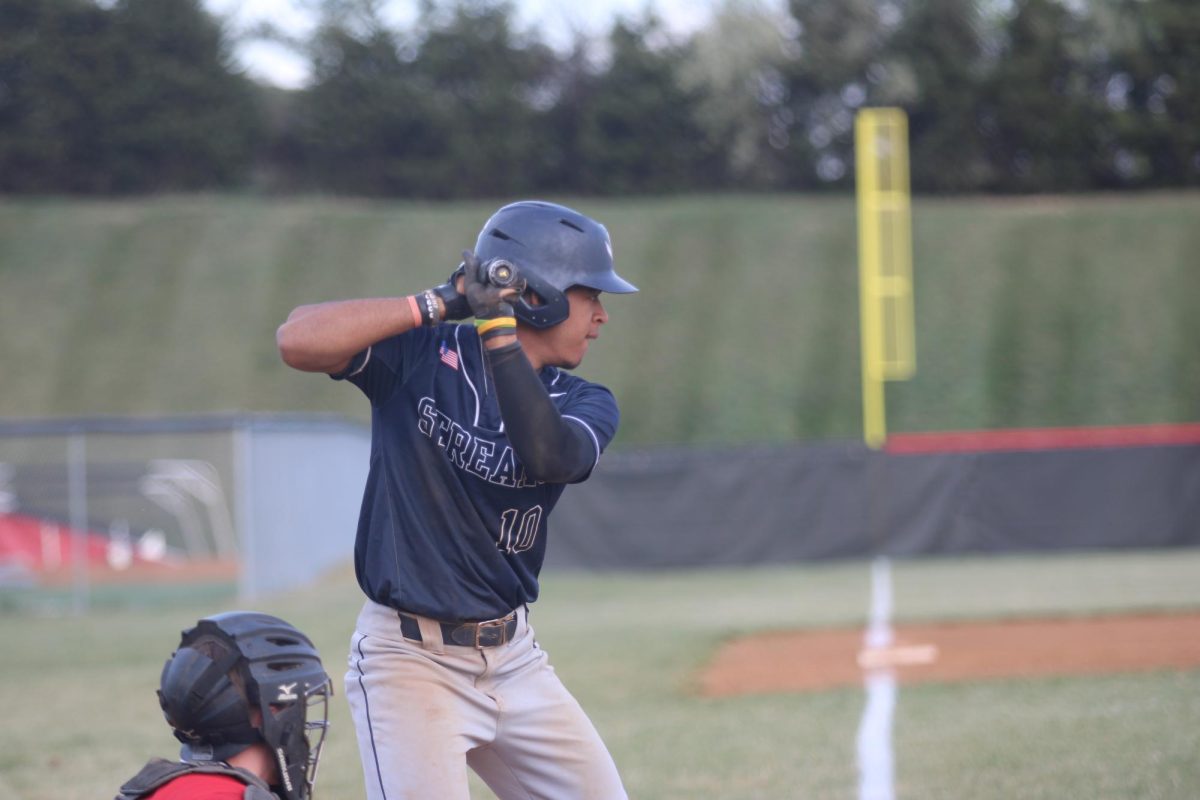 senior Johan feliz waiting for the ball to come to bat 