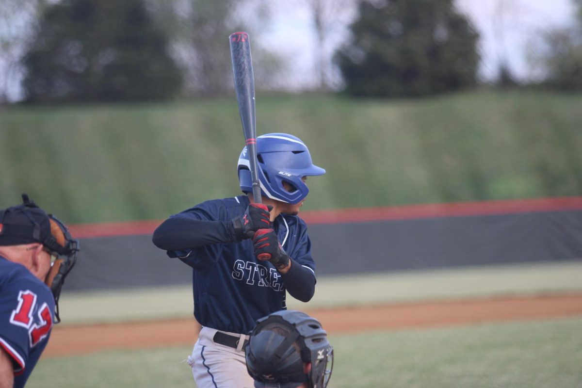junior diego pichardo waiting to bat the ball