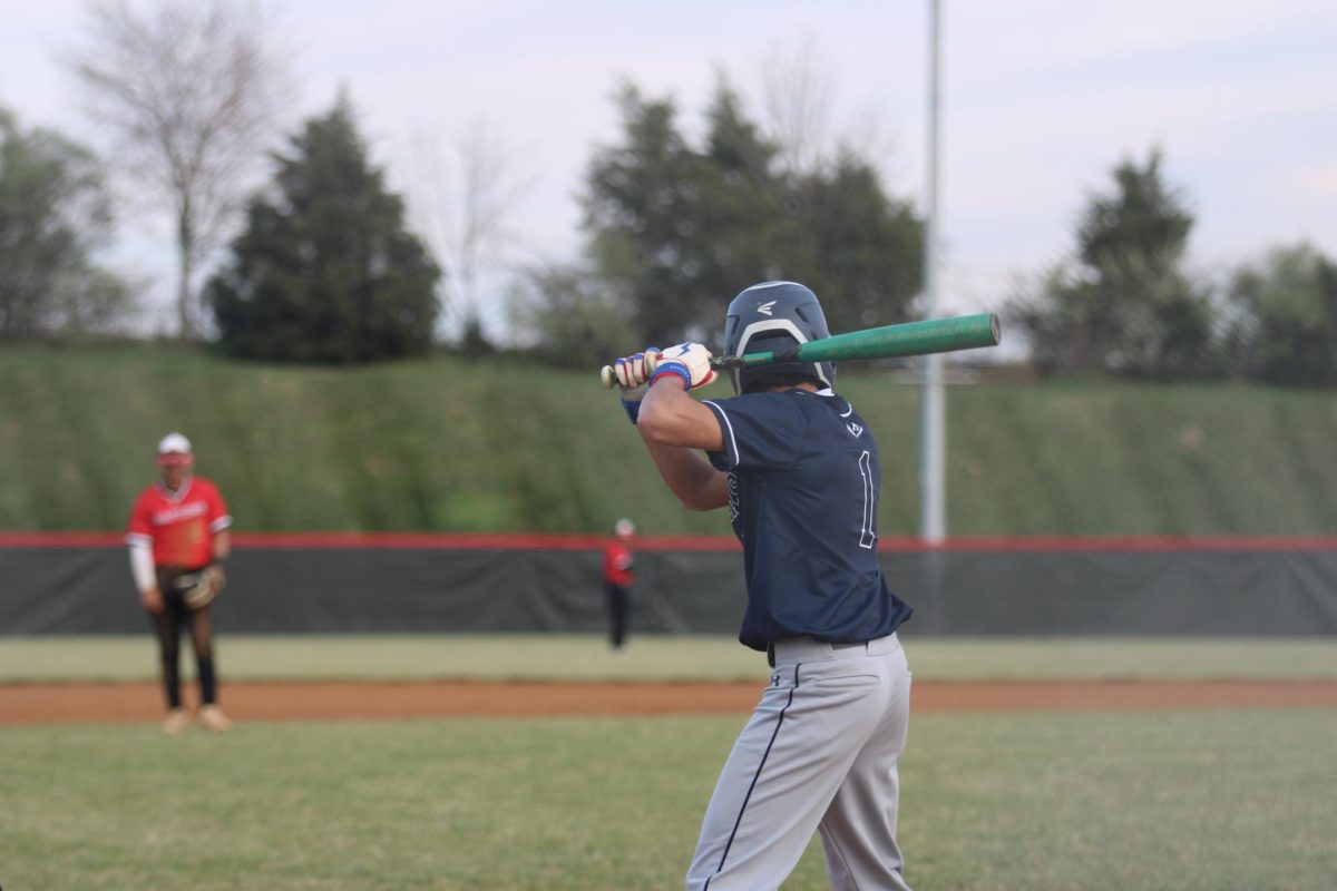 senior Javier molina practicing to bat 