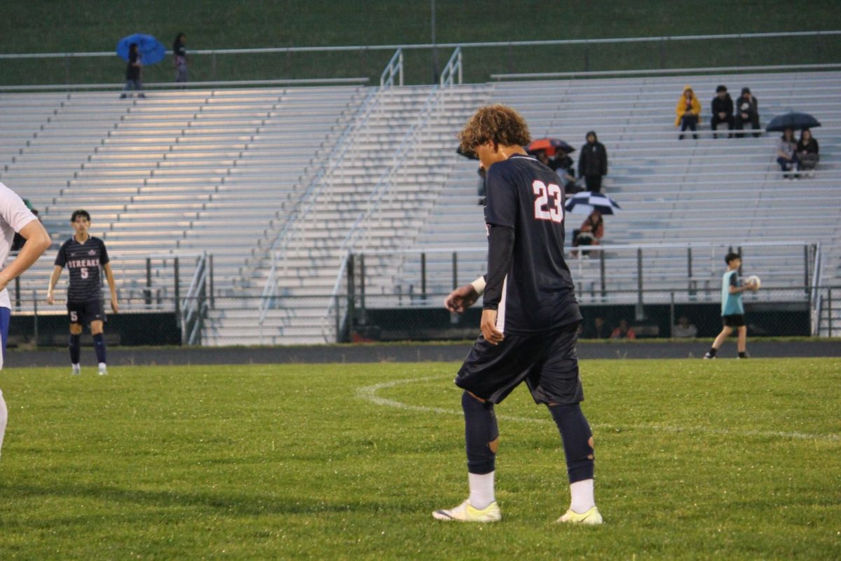Junior Kaiden Velasquez walking towards the other side of the field.