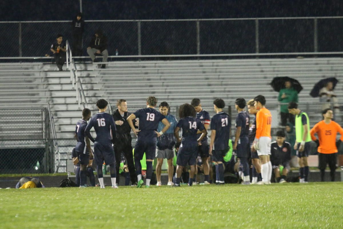 Varsity boys soccer together after their win against Spotswood.