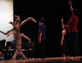 Students, a few of the 35 that joined this project, dance gracefully at the front of the stage.