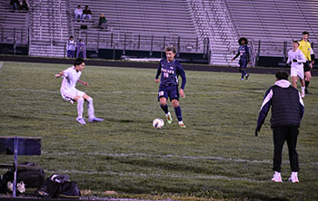 Senior Rayyan Garout dribbles the ball to goal.