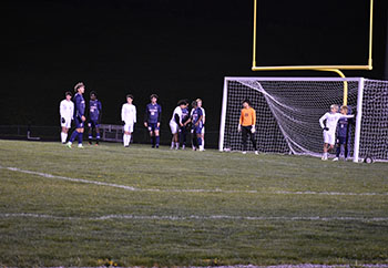Both HHS and opposing team preparing for corner kick at the Blue Streaks goal.