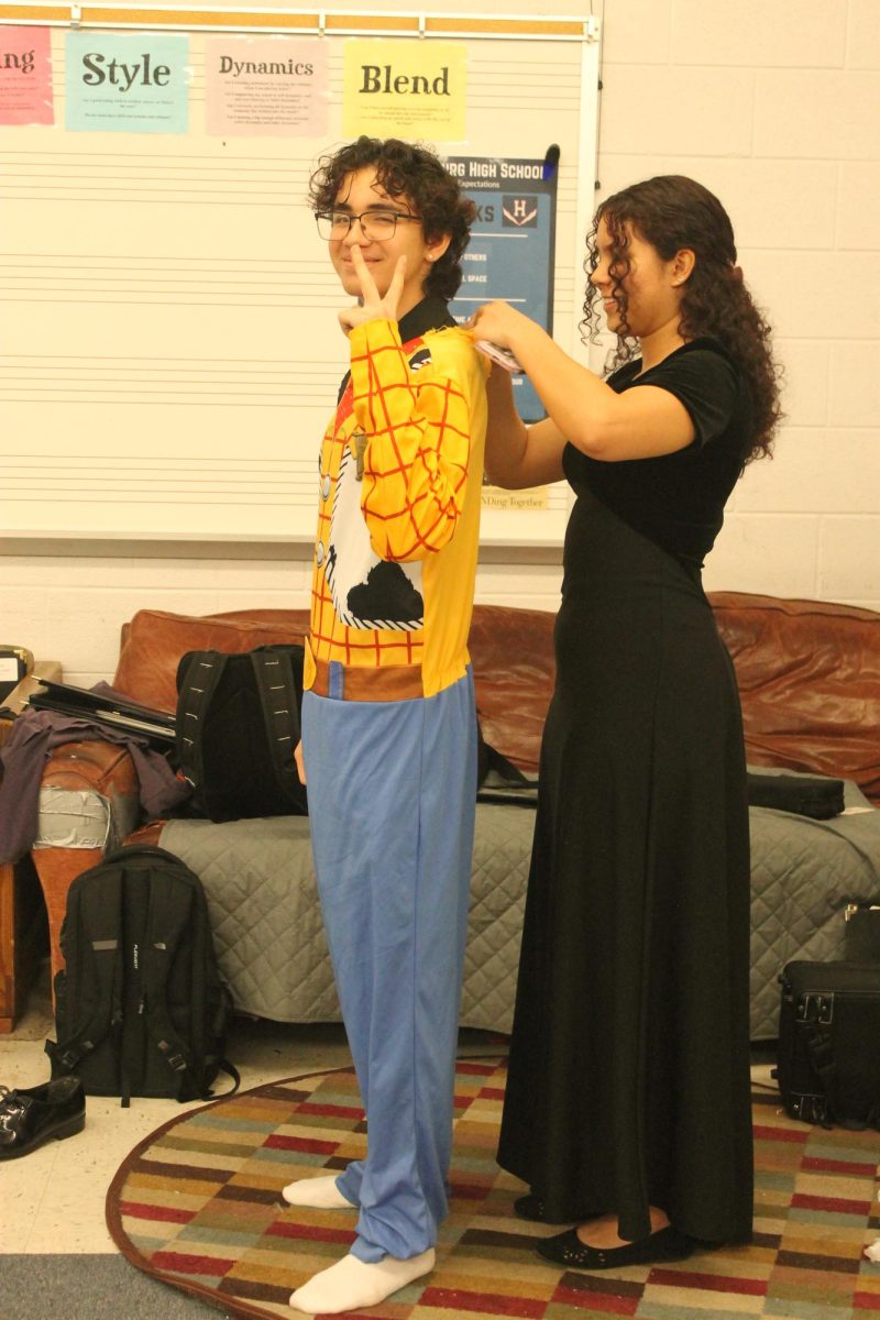 Jose Rocha Salva putting on his costume