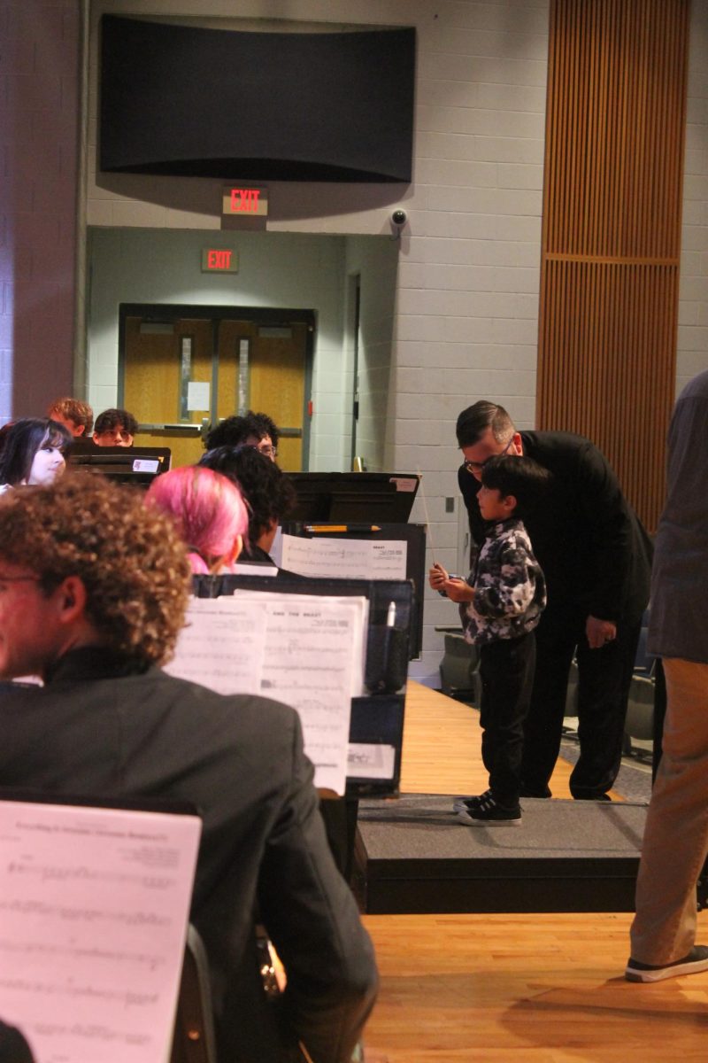 An elementary schooler conducting the band