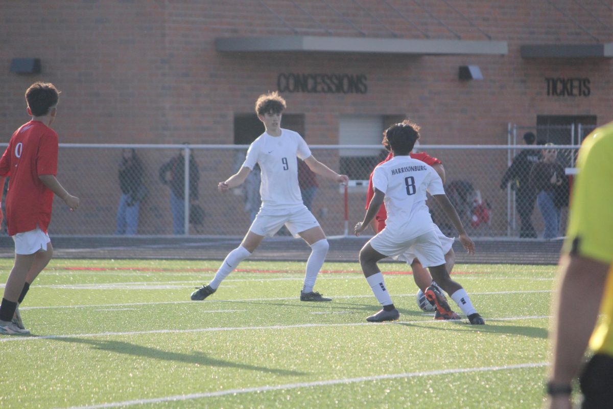 leo Kurtz and Riyo Loku defending the ball from the opponent.