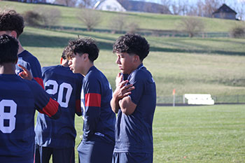Players listening and being focused.