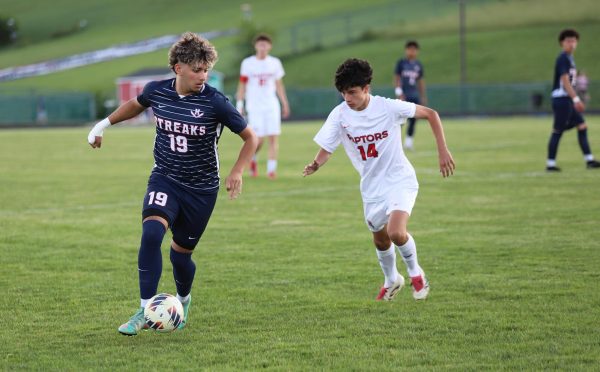 Senior Rayyan Garout charges down the field.