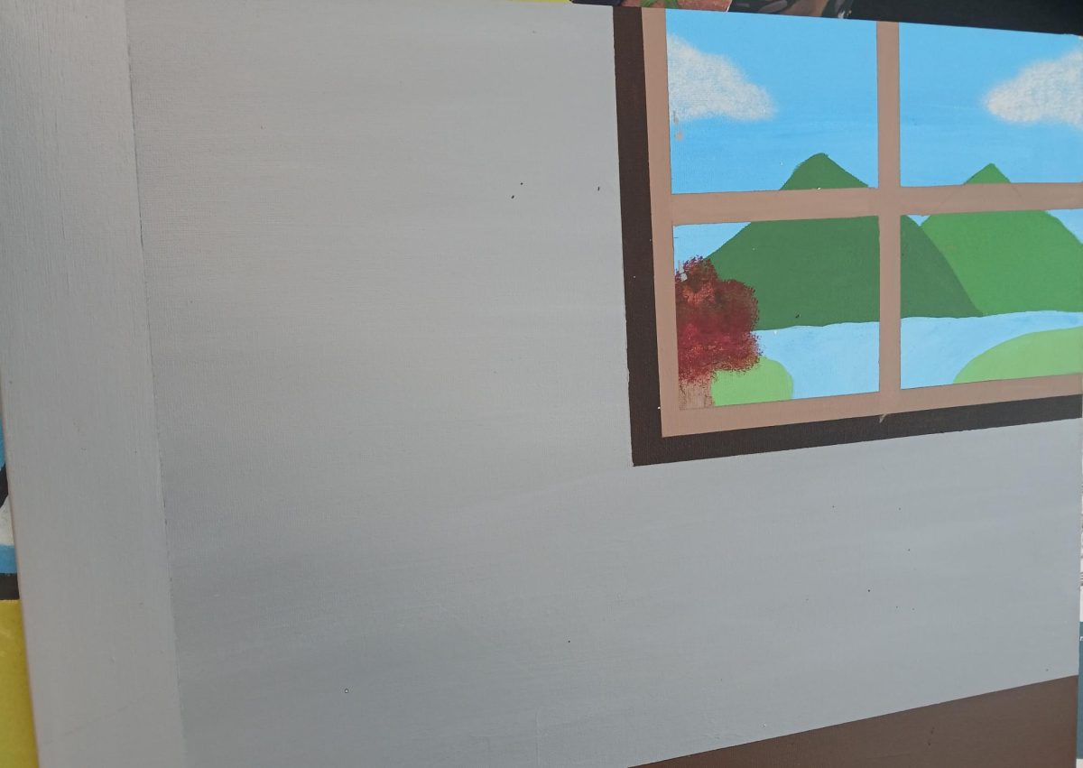 Inside Harrisonburg High School’s art classroom, it holds a painting with a window that shows green mountains, a lake, and green hills. This painting seems simple, yet it contains a story behind it from the perspective of the painter. “This painting is simple and neat, and the student was very interested in getting it done, so I know they wanted to do this very much,” Brooks says.