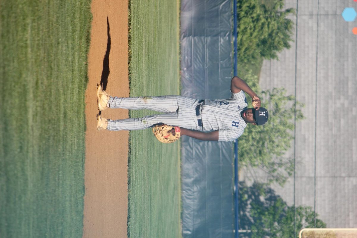 Senior Mason Smith, stands tall at first base, eyes locked on the camera with quiet confidence. Though the play hasn't started, his focus never wavers—always prepared for the next move. A steady presence on the Blue Streaks’ defense, Mason leads with composure and grit.