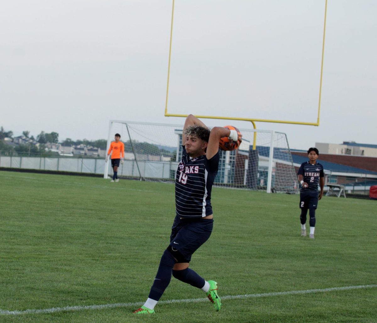 Senior Ryyan Garout about to throw the ball 