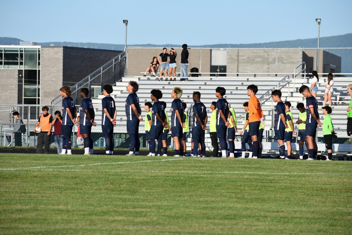 Starting lineup standing for the national anthem.