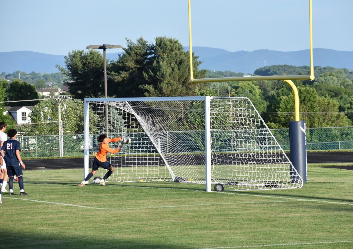Senior Adolf R Rivas diving for the ball.