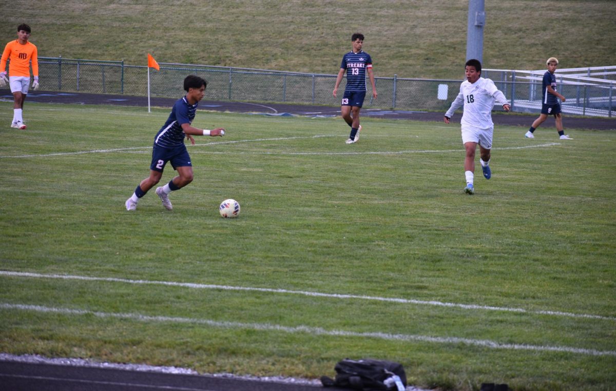 Freshman Andy Mendoza preparing to kick the ball.