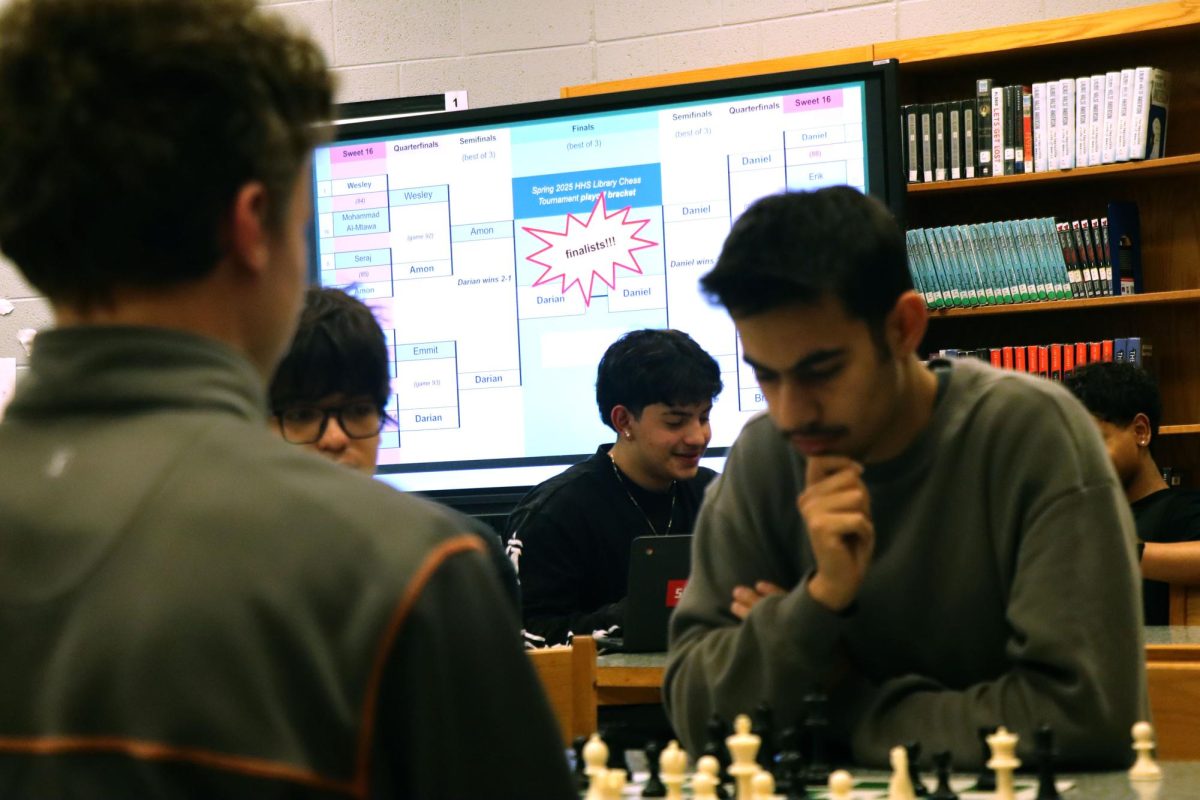 The Chess tournament finalist sit down to see who will come away with first place.