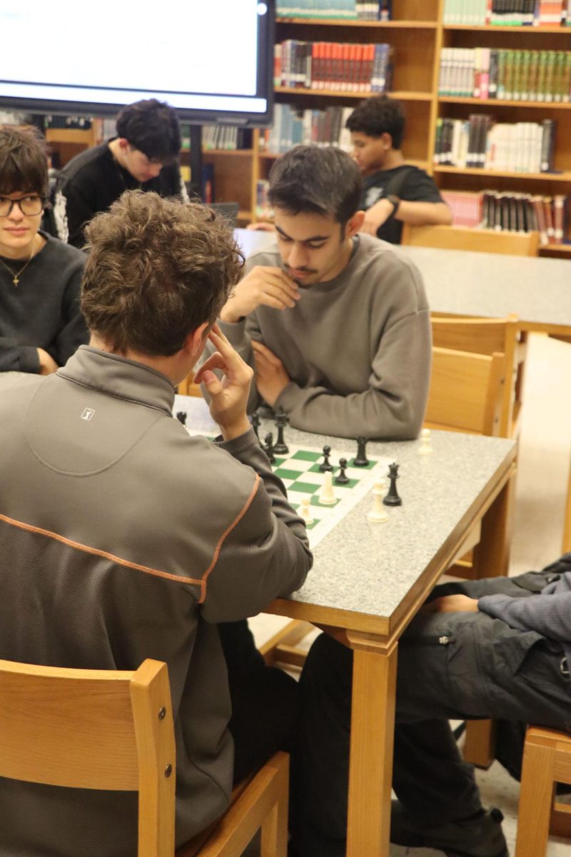 Marusich and Aland consider their positions on the board.