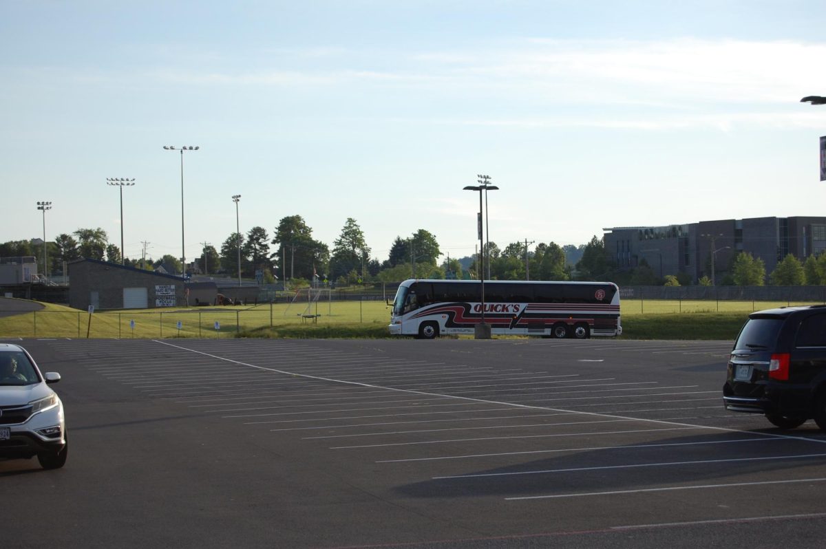 Busses arrive for the trip.