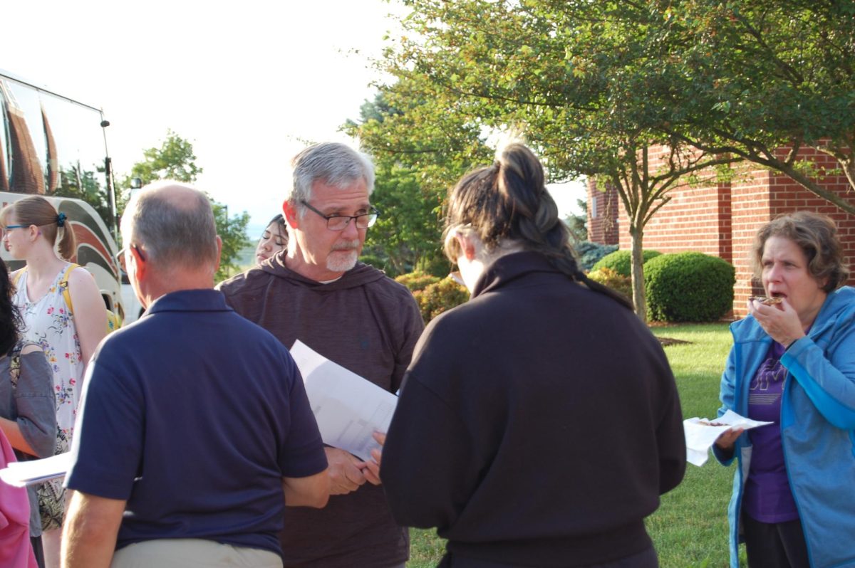 Mr. Healy Scans crowd for unchecked students.