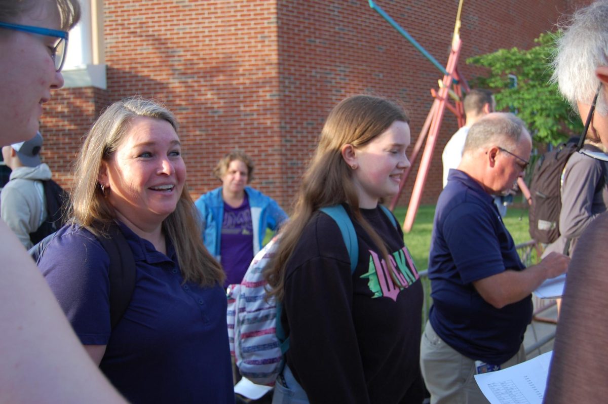 Mrs. Tibbles brightens the mood for the waiting bus riders.