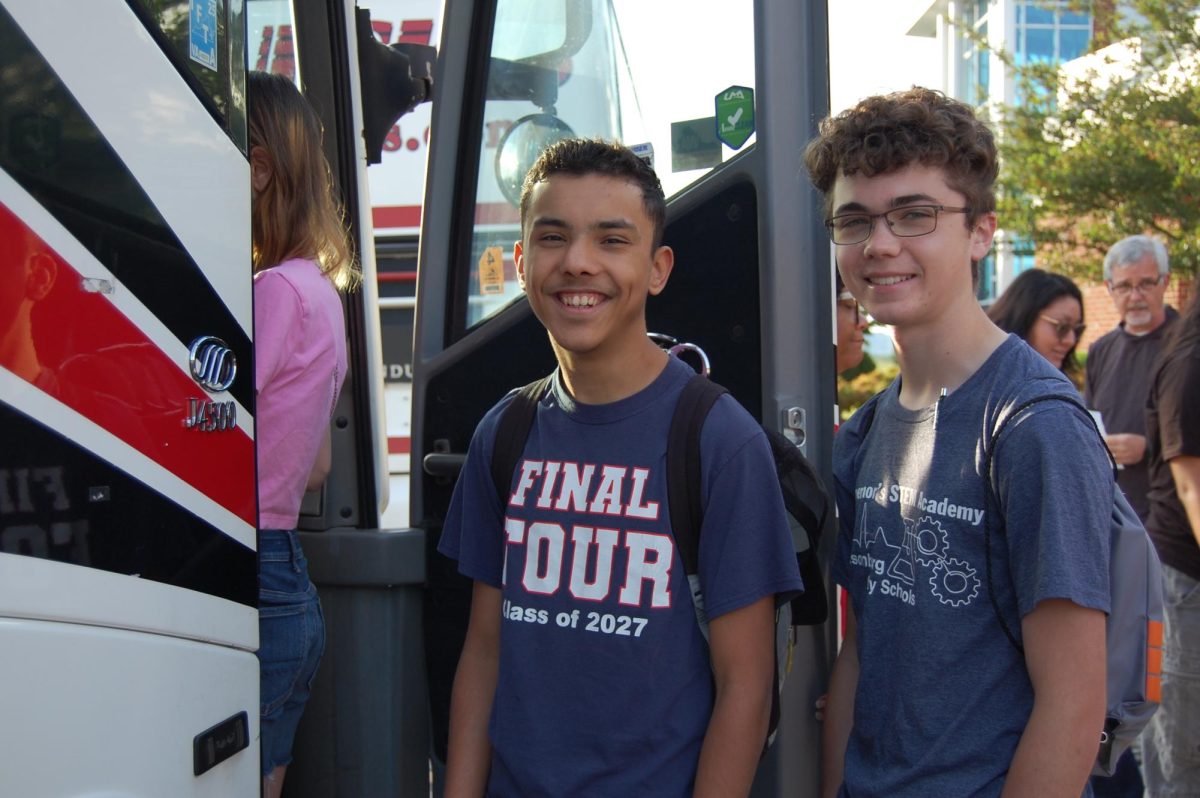 Sophomores Elio Cortina and Samuel Walton board the bus.