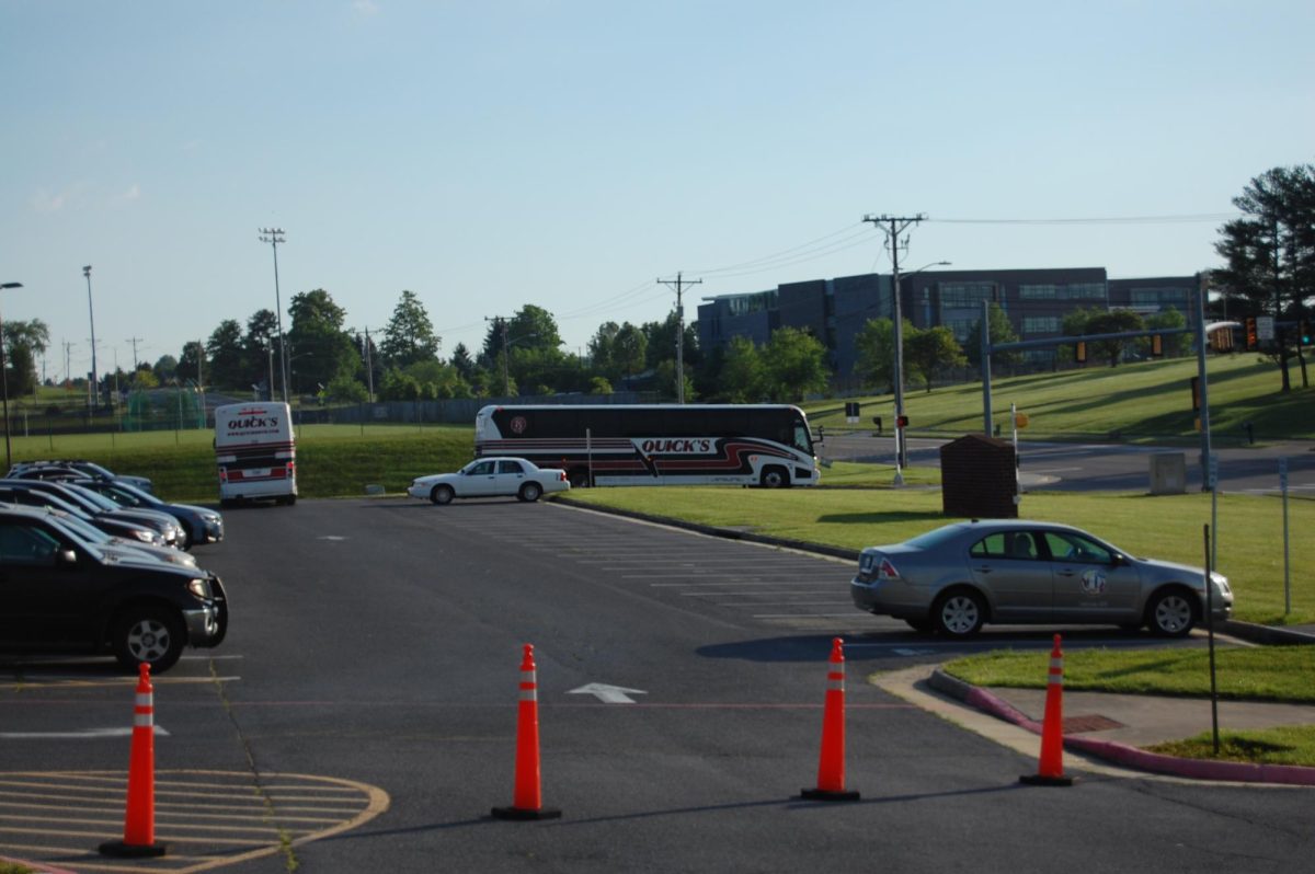 Busses leave parking lot with students headed for DC.