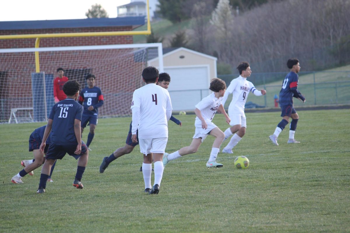 Wearing #15, Kevin Velasquez Garcia races past defenders with speed and control.The freshman helped HHS stay on the attack. His hustle gave the Blue Streaks a strong edge.