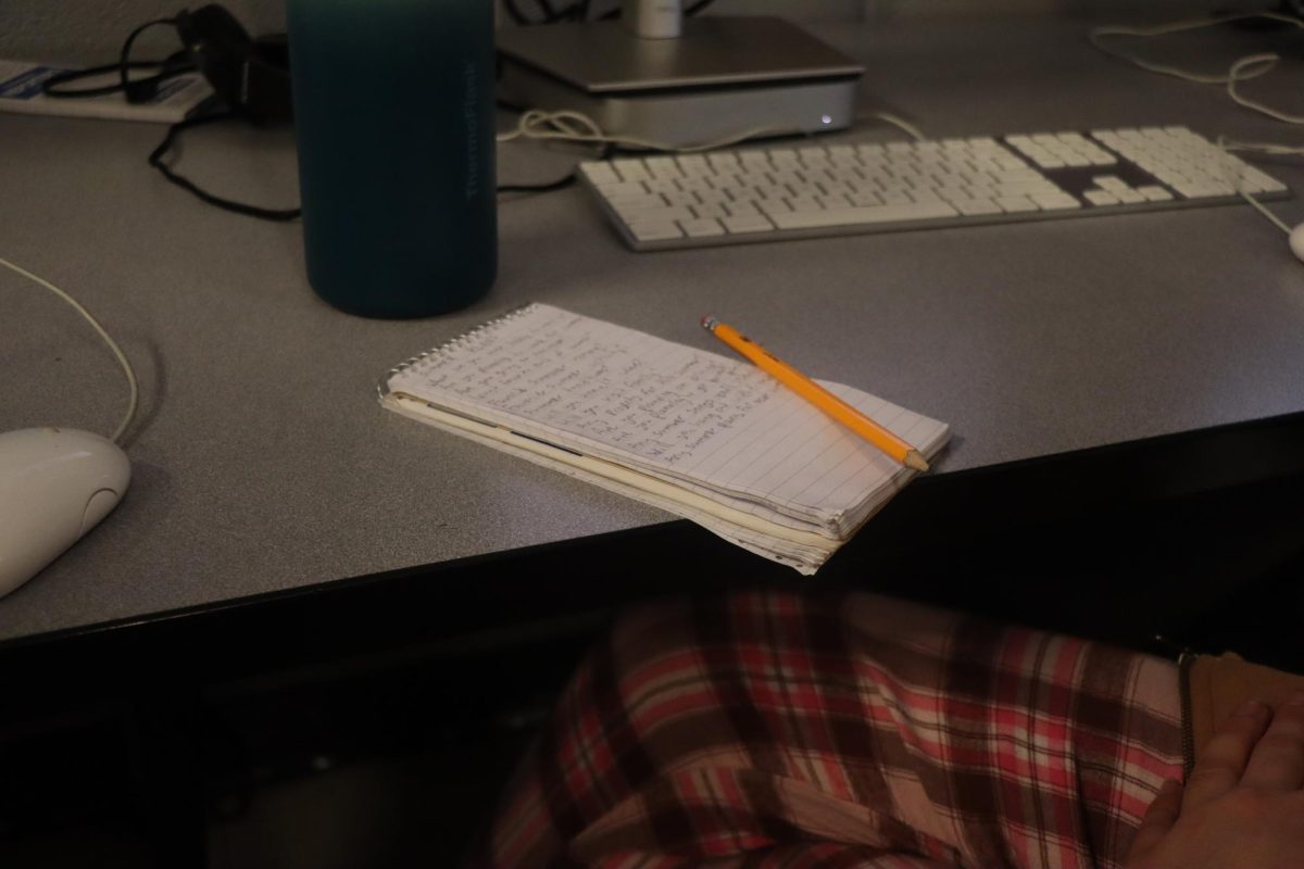 Sophomore Katie Bush writes down questions for an interview.