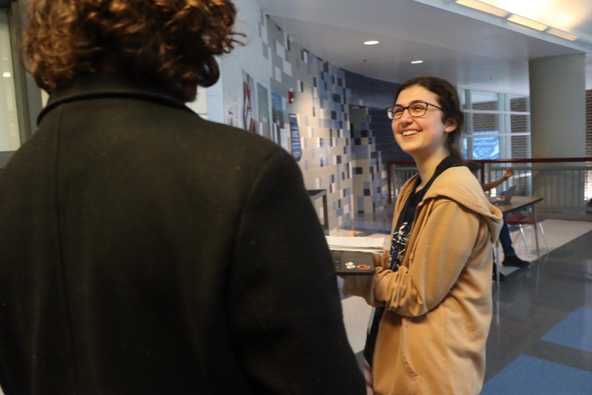 Sophomore Katie Bush smiles as Junior Carter Steihl answers her questions.