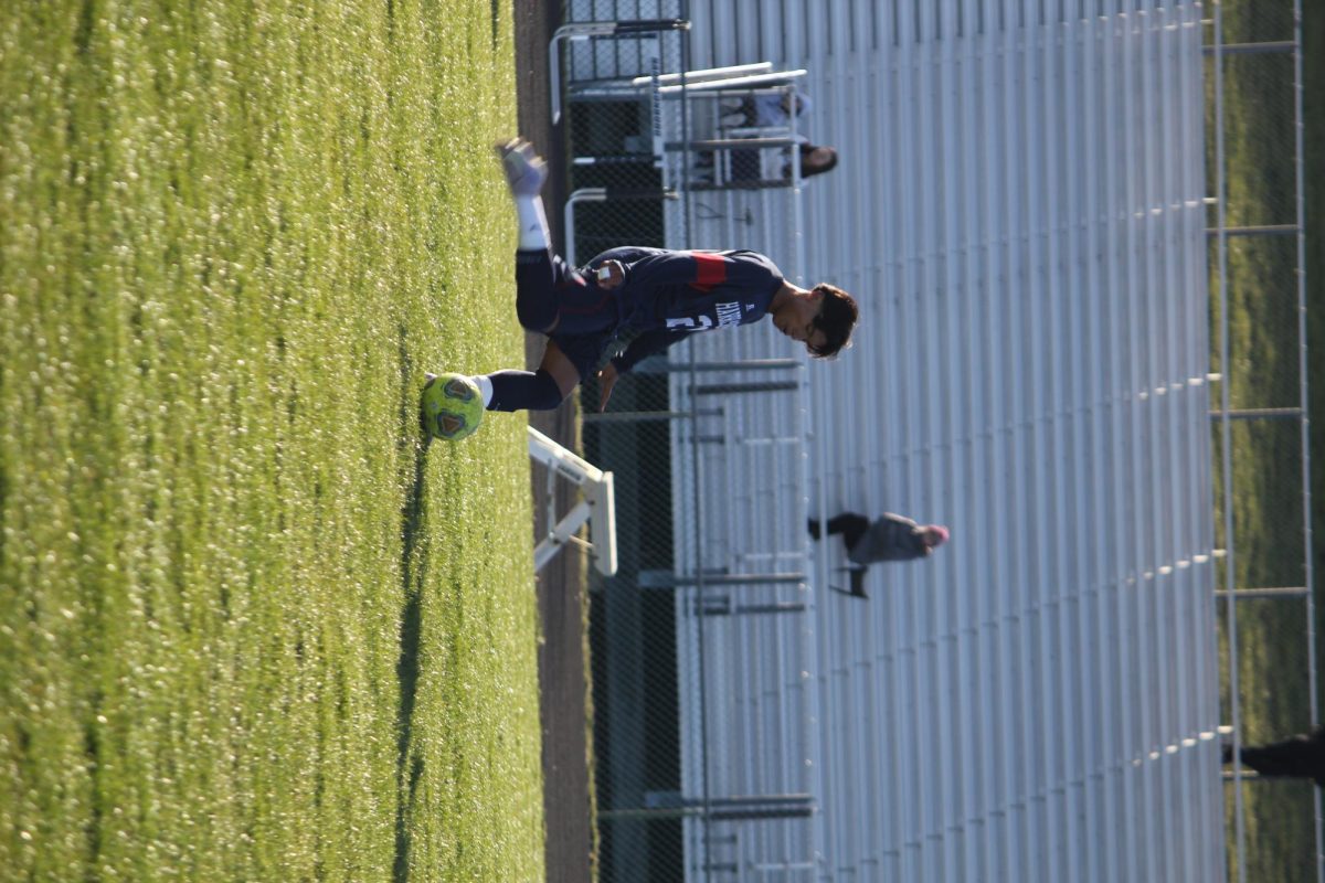 Freshman, #20 Andy Mendoza steps into the ball with power and precision. His confident kick helps move the Blue Streaks up the field during a key play. Even as a freshman player, Mendoza shows skill and composure.