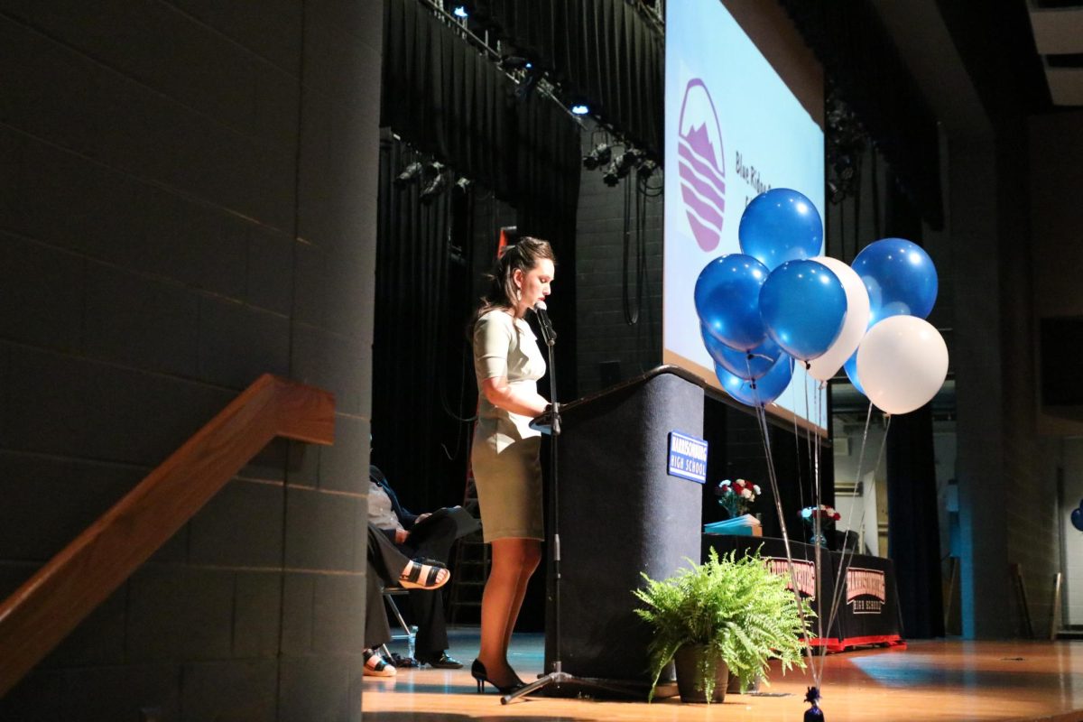 Blue Ridge Community College admissions representative presenting awards for class of 2025.