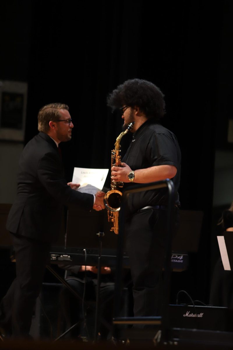 Isaiah Moats receiving the Louis Armstrong Jazz Award. "I truly am happy I got the award for playing an instrument I love".
