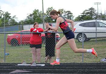 Penny Brett jumping out of the blocks.