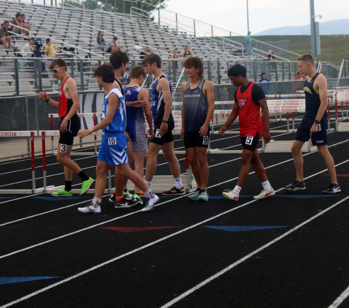Wesley Swartz is prepping for the 4x800, getting ready for the baton to get handed to him next. With all the other teams standing beside him, he's not scared at all and is ready to run.