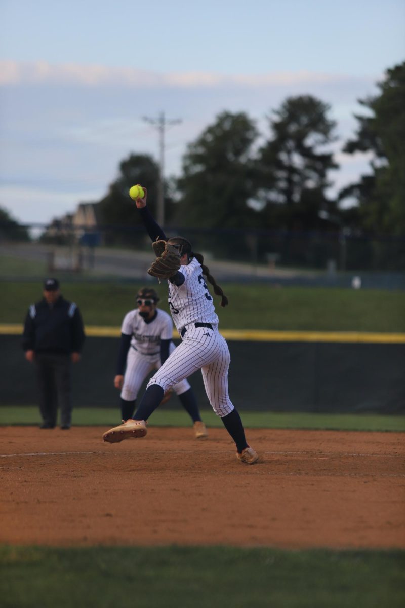 Delaney Dayton pitching. "I really love softball and the friends that come with it".