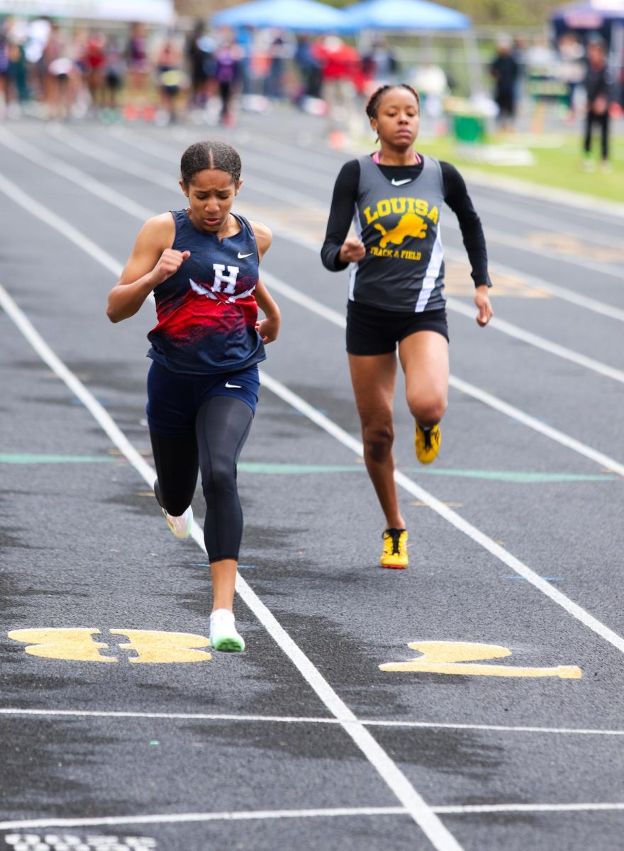 Freshman Gabrielle Jackson looks down while finishing her race. 