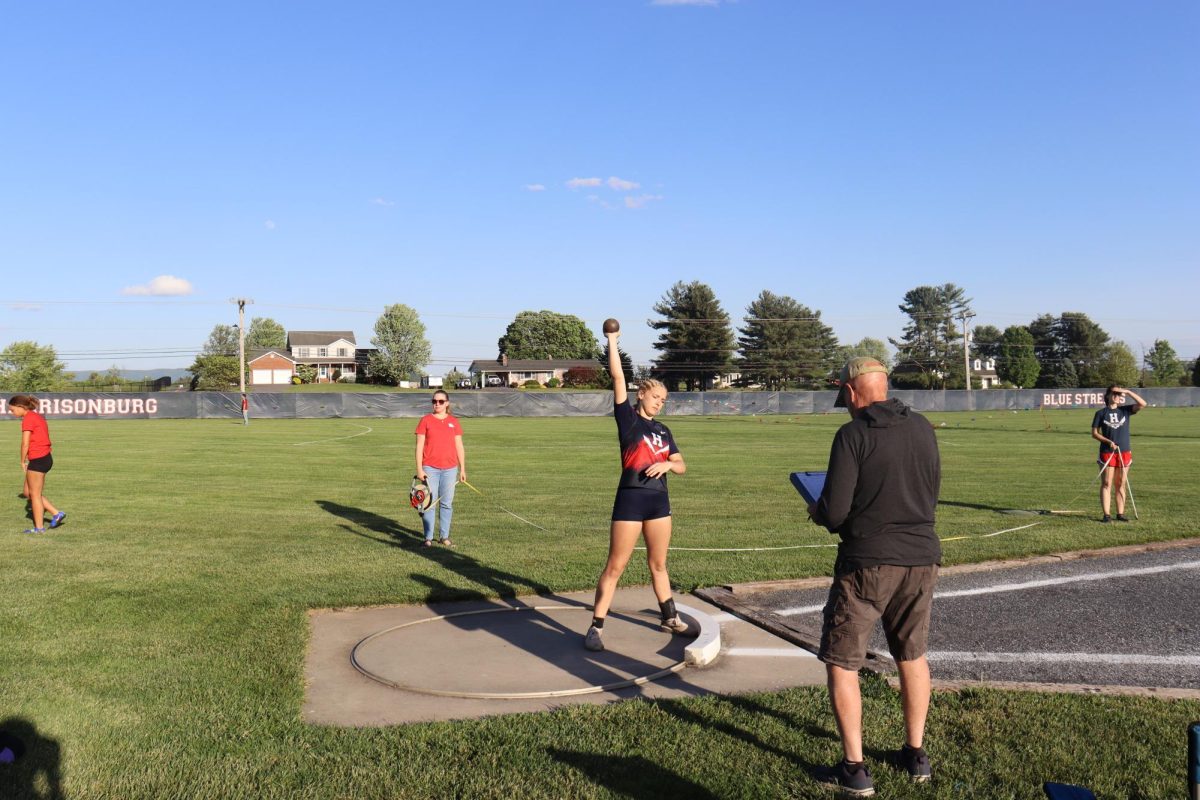 Leah prepping the shot and where it will rest for her throw.