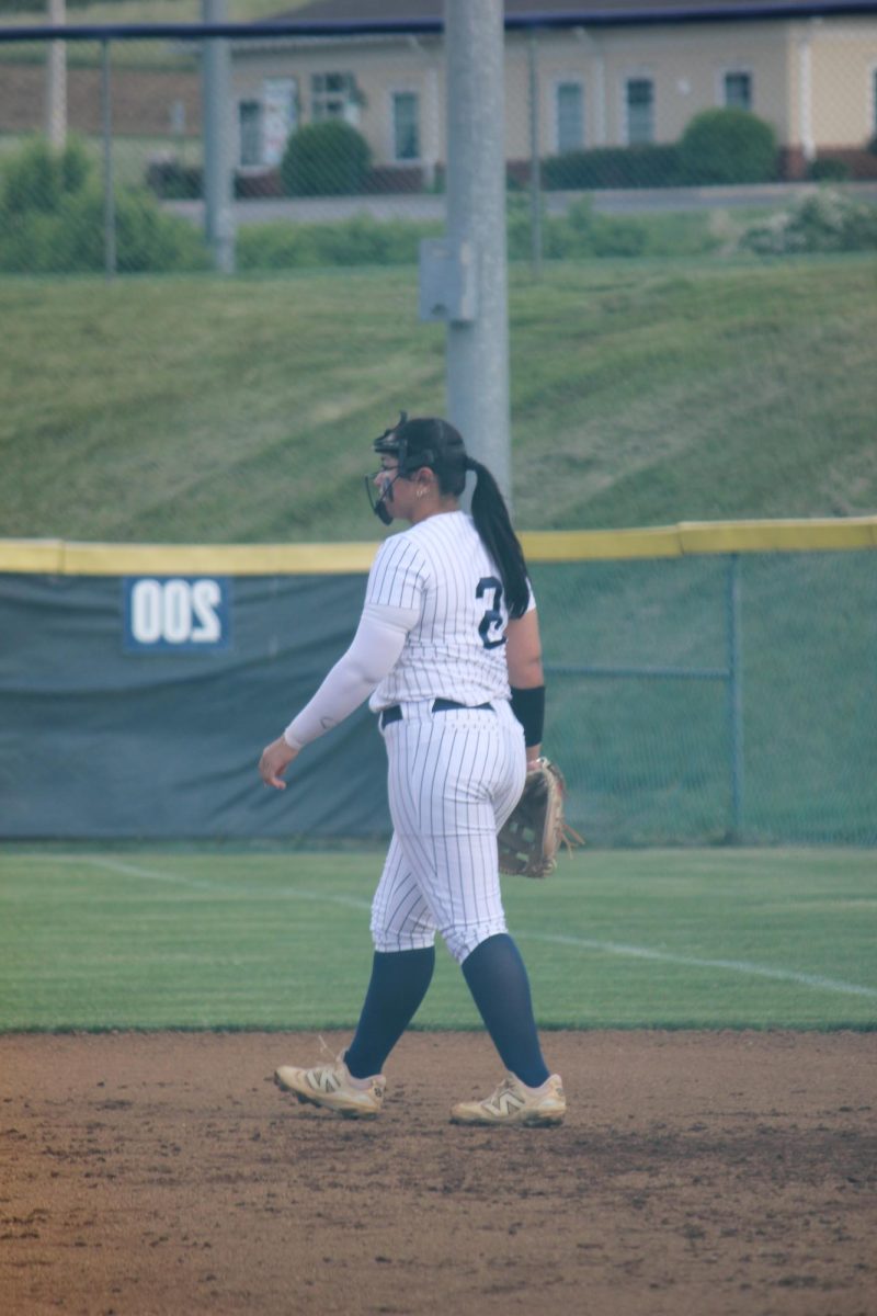 Kayli Alvarado is walking back to her spot after getting the other teams player out.