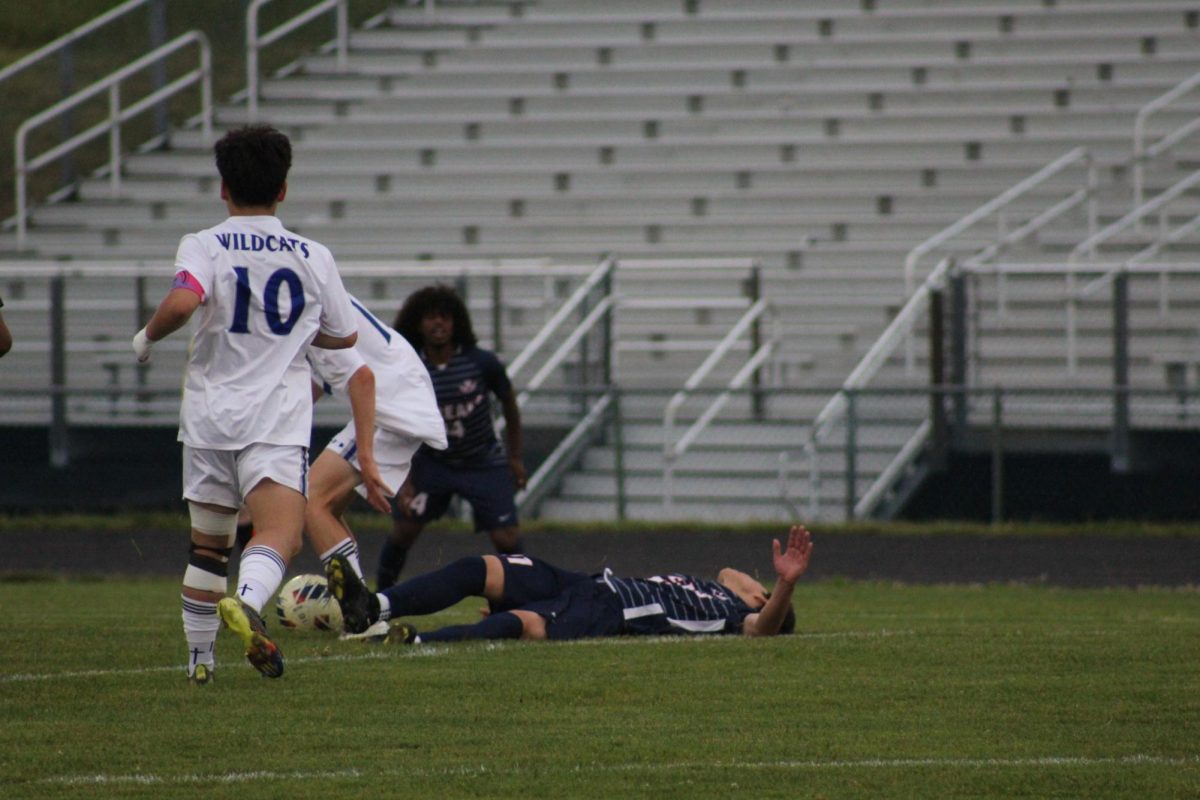 Senior Izaack Cruz remains on the ground after an injury.