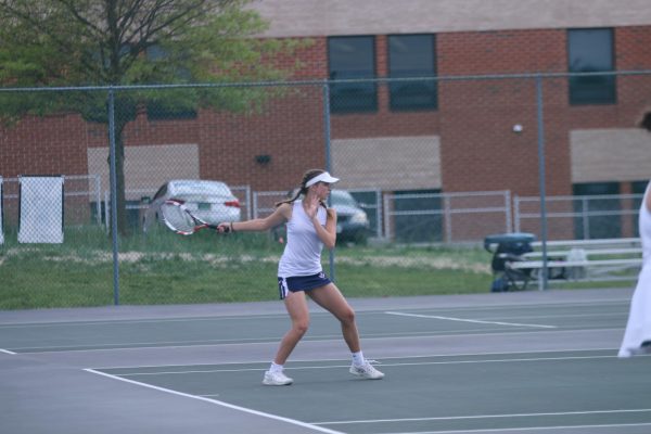 Macy smacks the ball back over the net
