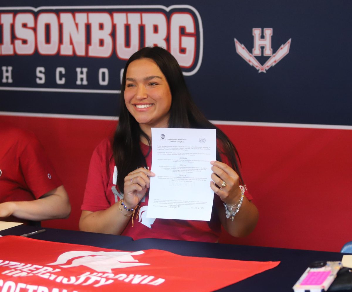 Senior Kayli Alvarado shows off her signed contract.