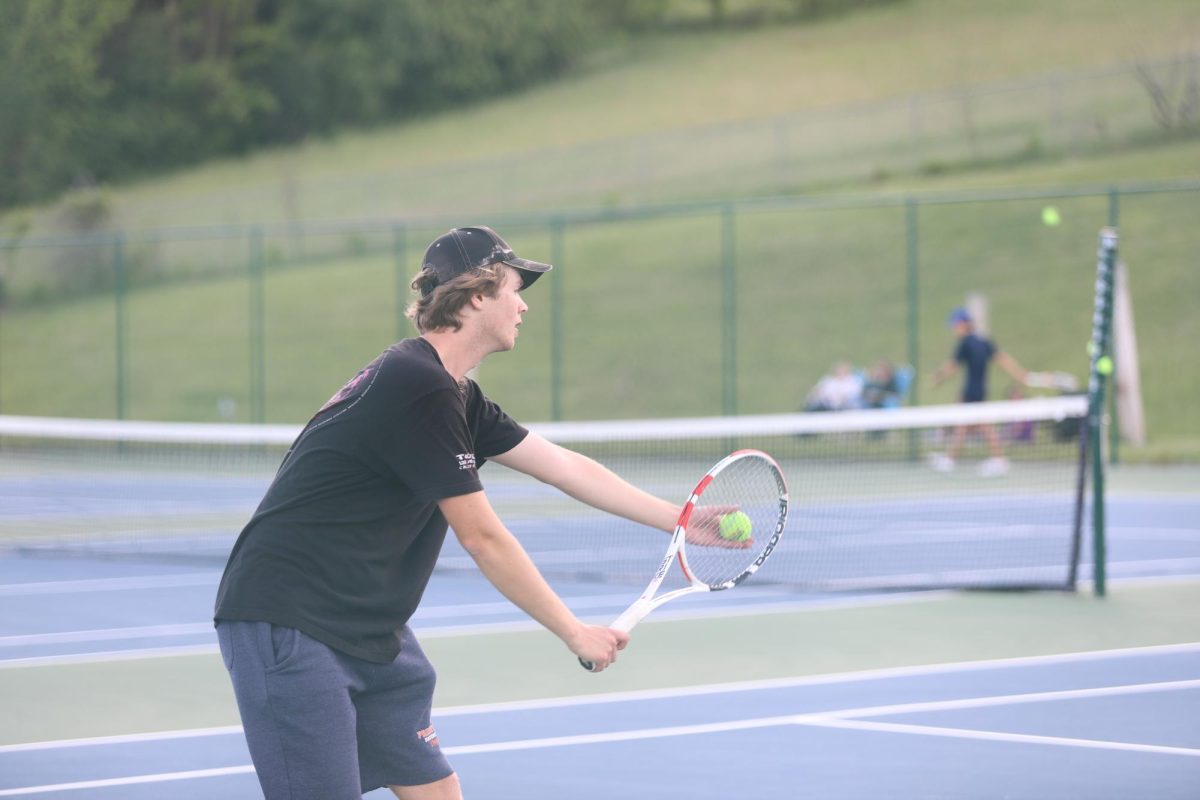 Senior Andrew Lankford about to serve the ball.