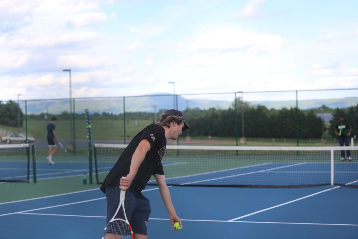 Senior Andrew Lankford serving the ball.