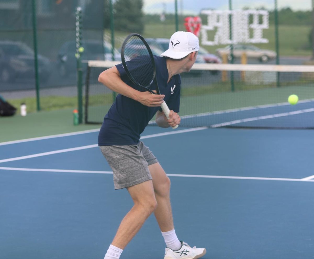 Senior Louis Gibson getting ready to hit the ball.